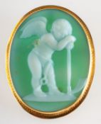 A green glass cameo brooch pendant, carved with a cherub in a plain and carved pattern mount,