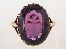 An amethyst ring, claw set with an oval-cut amethyst, measuring approx. 17.0mm x 13.0mm x 9.