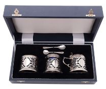 A modern cased three-piece silver condiment set, circular form,