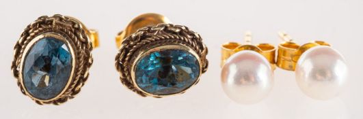 Two pairs of earrings, including a pair of stud earrings, each set with a single cultured pearl,