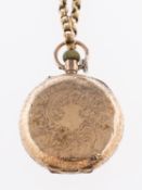 A lady's 9K gold open-faced pocket watch the gold dial with matted and engraved centre,