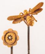 Two stick pins, including a stick pin with a winged insect, marked 15ct to verso, metal pin,