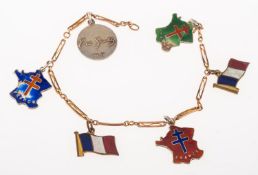 A bracelet with six French related charms, an openwork fancy rectangular link bracelet, marked 9ct,