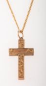 A 9ct gold cross pendant with chain, a foliate carved cross pendant, UK hallmark, length approx. 2.