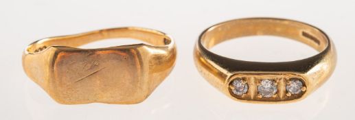 Two 9ct gold rings, including a 9ct gold ring set with three circular-cut white paste stones,