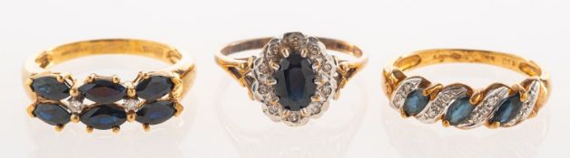 A group of three 9ct gold sapphire and diamond rings,