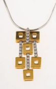 A diamond pendant with chain, the bi-colour pendant having two fixed openwork squares,