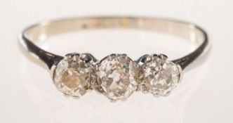 A three stone diamond ring, claw set with three old-cut diamonds, diamonds approx. 0.