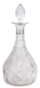 A George V silver mounted clear cut-glass decanter, with a bellied body and a star-cut base,