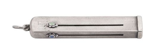 An Art Deco silver plated combined manicure set, the body with engine-turned decoration,