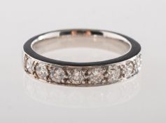 A diamond half eternity ring, grain set with nine brilliant-cut diamonds, diamond approx. 0.