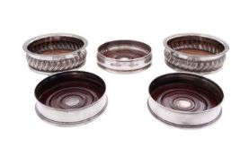 A pair of modern silver wine coasters, circular form,
