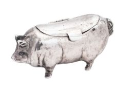 A continental silver pig box, 800 standard, with a hinged cover on its back, marks indiscernible,