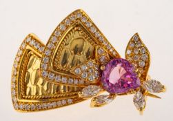 An impressive pink sapphire and diamond brooch, of modern stylised floral and foliate form,