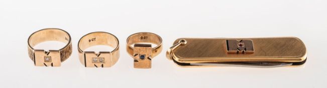 Monsanto - Three rings and a penknife, including a ring with a polished letter 'M' (for Monsanto),