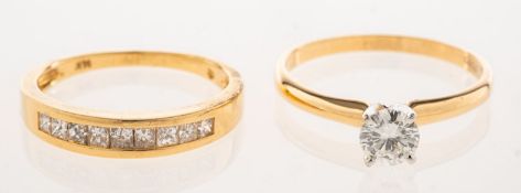 Two diamond rings, including a solitaire ring, high claw set with a brilliant-cut diamond,