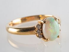 An opal and diamond ring,