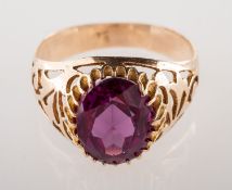 A synthetic alexandrite ring, claw set to the centre with an oval-cut synthetic alexandrite,