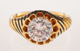 An early 20th century enamel and paste stone set ring,