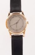 Ernest Borel, an 18K gold wrist watch the round silvered dial having Arabic and dot numerals,