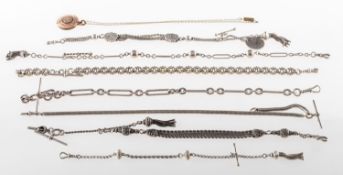 A group of seven watch chains and a souvenir pendant,