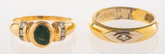 Two rings of varying design, including a bi-colour band set with a single brilliant-cut diamond,
