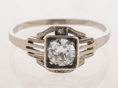 An Art Deco diamond ring, of square geometric openwork form,