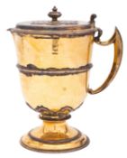 A George V Britannia standard silver gilt flagon, of circular form,
