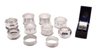 Eleven silver napkin rings, including a cased example, mixed makers & dates,