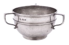 A George V three-handled silver bowl, circular form,