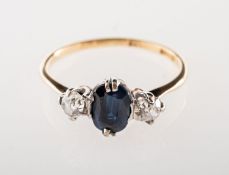 A sapphire and diamond three stone ring,
