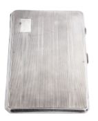 A WWII period silver cigarette case, of canted rectangular form, with engine-turned decoration,