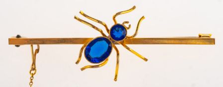 An insect brooch, set with a circular-cut and an oval-cut blue paste stone, safety chain,