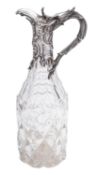A Victorian silver mounted clear cut-glass claret jug,