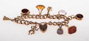 A charm bracelet with fob seals, the bracelet of curb links with heart padlock and safety chain,