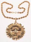 Edmund Kaszewski A 9ct gold and diamond smiling sun face pendant with chain,