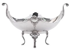 A George V silver two-handled dish, with a boat shaped body,