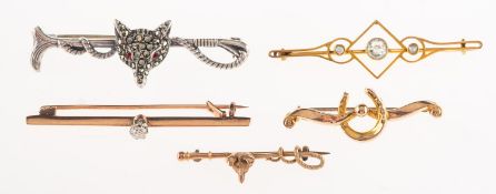 A mixed group of brooches, including a foxes head and riding crop brooch, marked 9ct to verso,