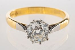 An 18ct gold diamond solitaire ring, claw set with an old cushion-cut diamond,