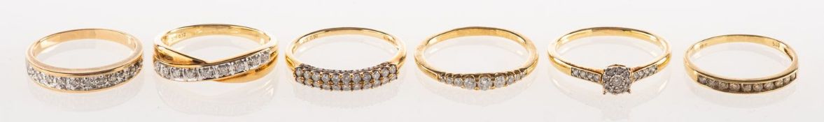 A group of six 9ct gold diamond rings,