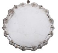 An Edwardian silver salver, of shaped circular outline,