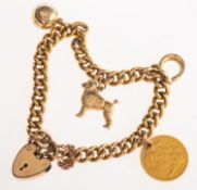 A rolled gold charm bracelet with attached charms,