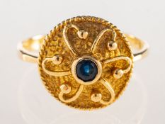 A sapphire ring, the raised domed head is collet set to the centre with a circular-cut sapphire,
