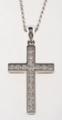 A diamond cross pendant with chain, a modern cross pendant, channel set with brilliant-cut diamonds,