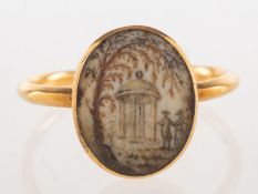A Georgian ivory hairwork ring,