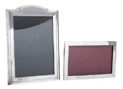 Two George V silver mounted photograph frames, one shaped rectangular, by Henry Matthews,