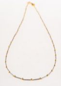 A bi-colour chain necklace, of alternating colour beads and textured finish overlaying tube links,