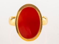 A 22ct gold carnelian signet ring, set with an oval plaque of carnelian, measuring approx. 18.