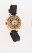 An 18k gold lady's half-hunter wrist watch,