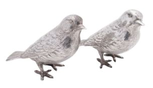 A near pair of Elizabeth II silver figures of birds, realistically modelled as two song birds,